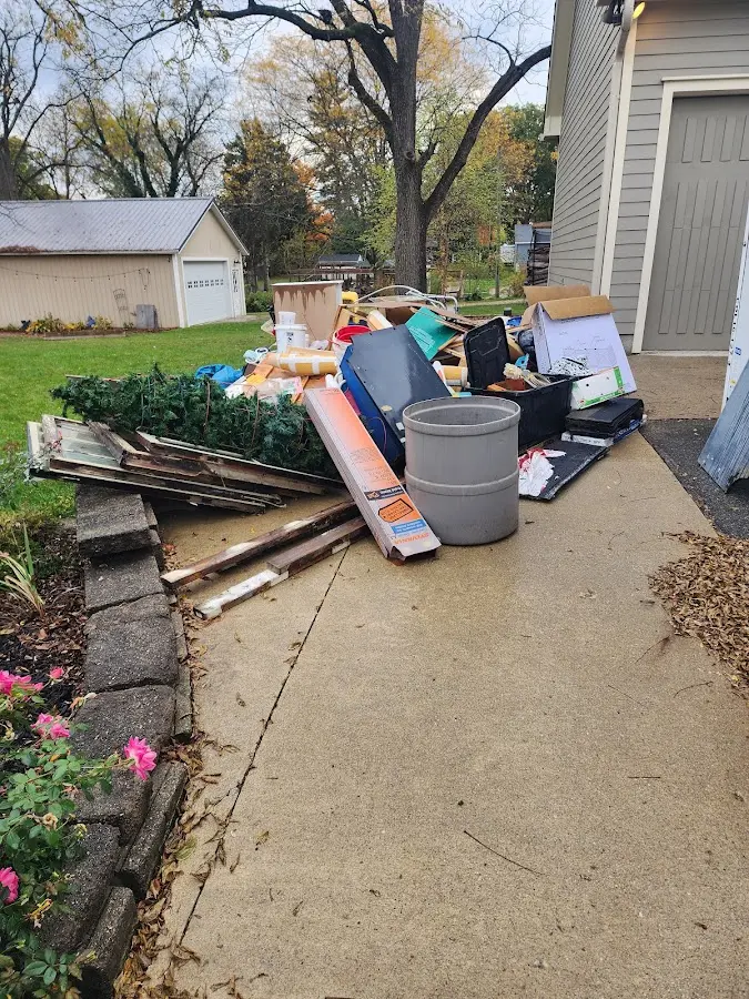 Dumpster being loaded with debris for 30 Yard Dumpster Rental in Northlake